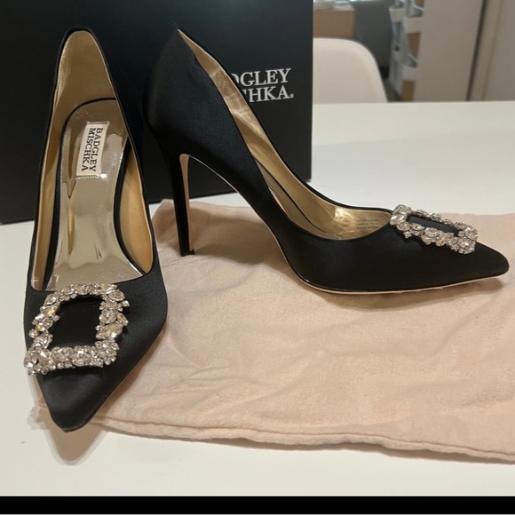 Size 9. Worn once for 3 hours. Extra heel tips and stones shoe bag original box